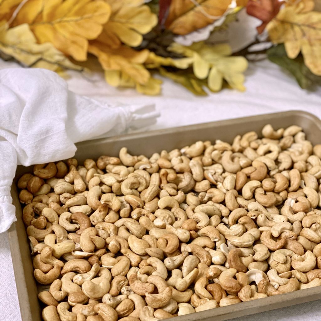 Cashews on a cookie sheet after they’ve been roasted in the oven.