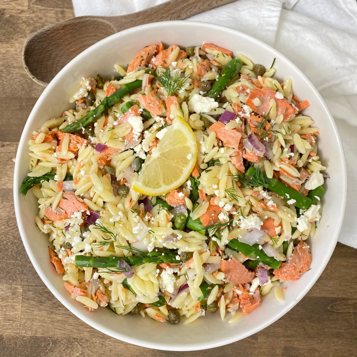 Salmon, Asparagus, and Dill Orzo Salad in a white bowl.