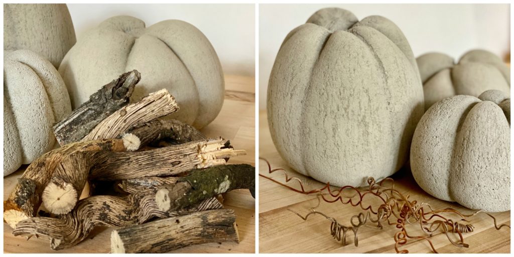 Concrete Pumpkins with a stack of sticks and curly vines to make stems and vines for the pumpkins.