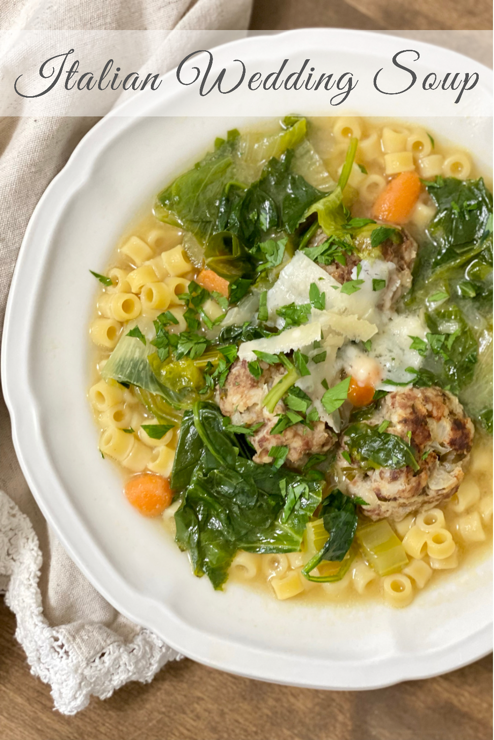 Pinterest Pin for Italian Wedding Soup in a white bowl with a napkin on the side.
