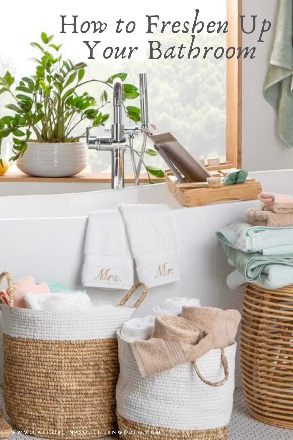Serene bathtub view with a plant in the window behind the tub and baskets next to the tub with plush towels in them.