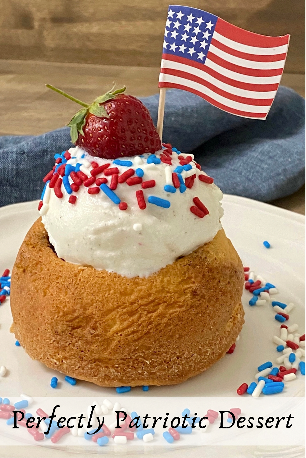 Pin for Pinterest of a vanilla cake bowl with vanilla ice cream inside decorated with red, white, and blue sprinkles and a strawberry on top.