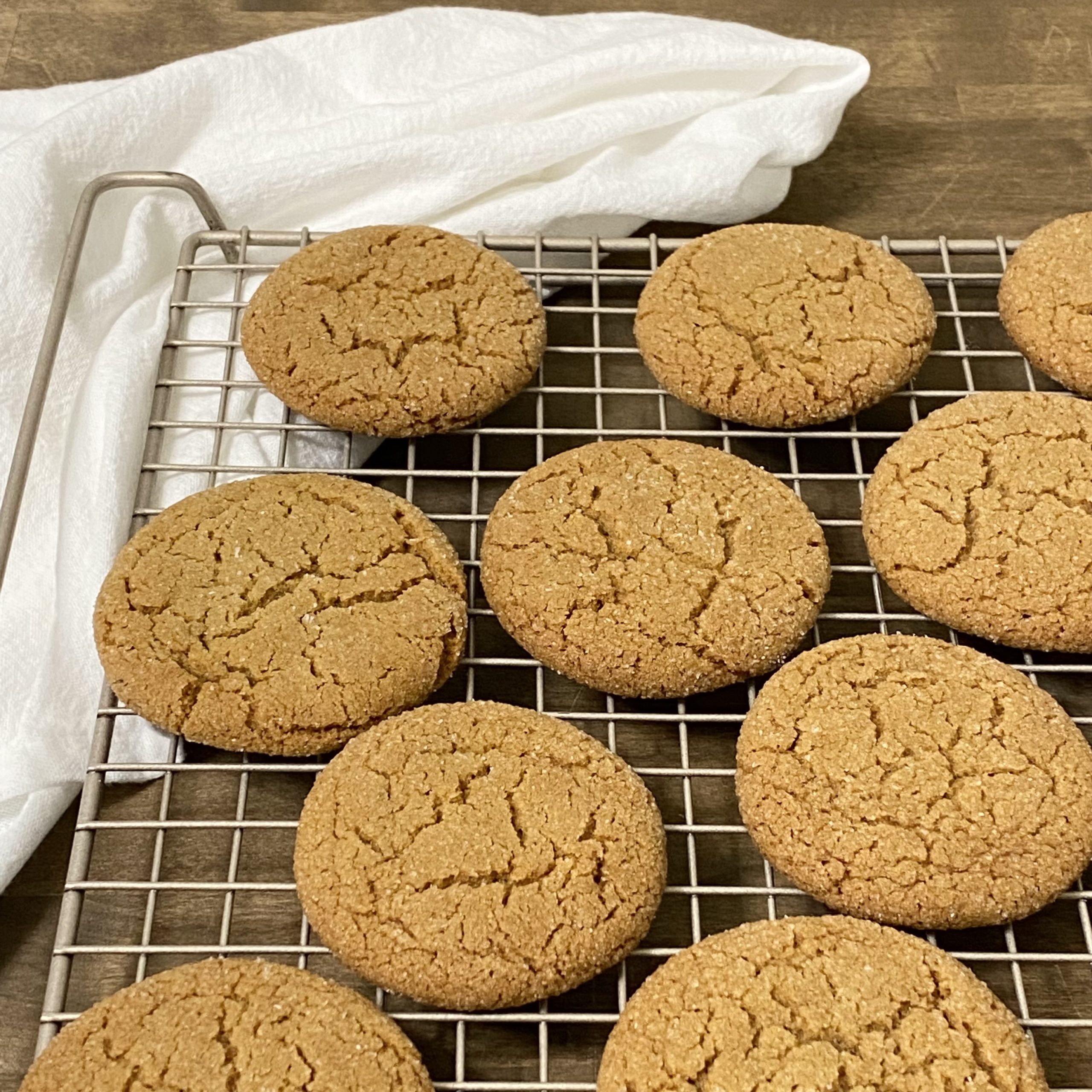 Pumpkin spice cookies cooking on a wire rack.