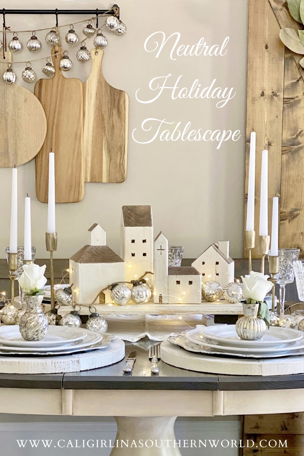 Pinterest Pin for a neutral holiday tablescape featuring gold, silver, white and wood.