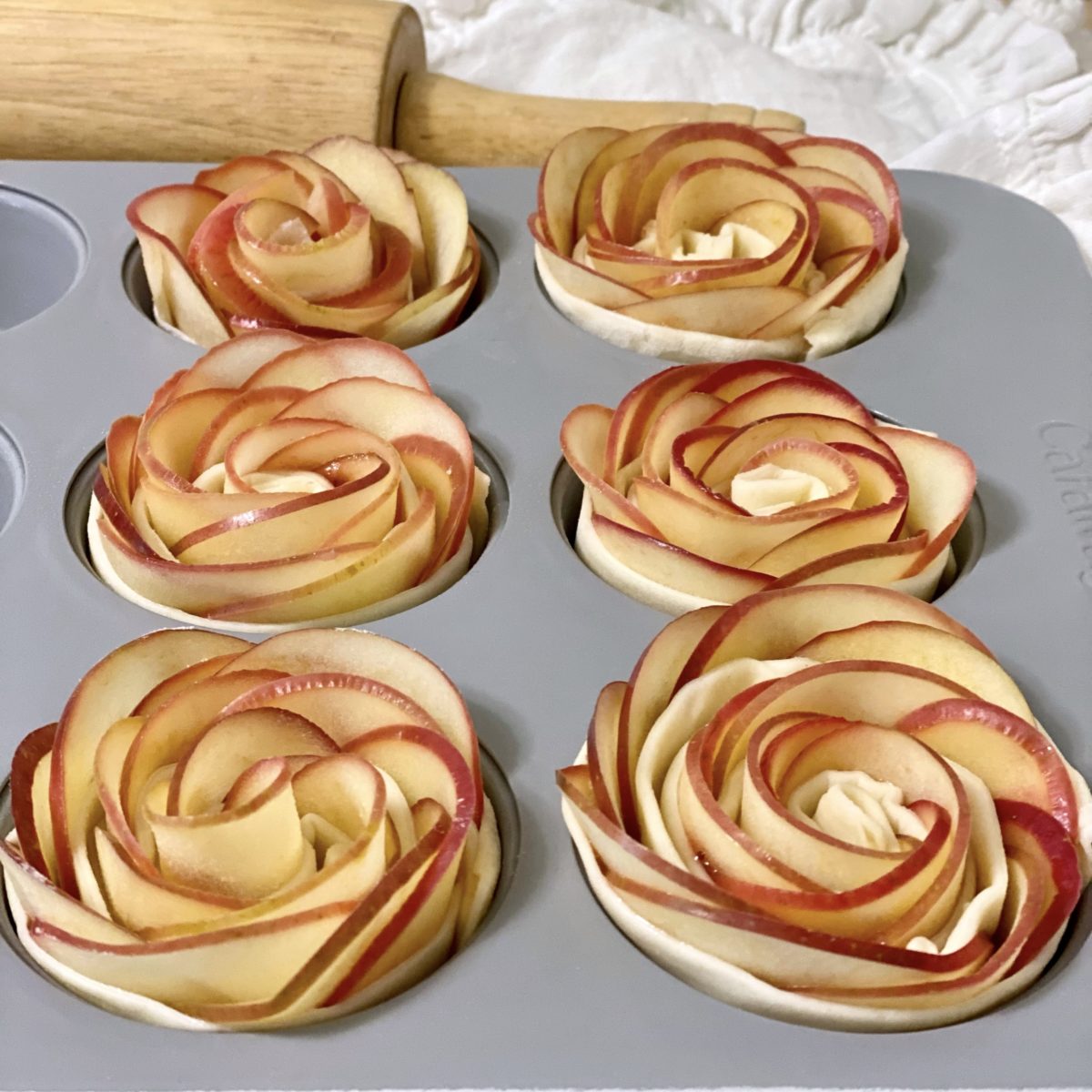 Baked Apple Roses in a muffin pan ready to go in the oven.