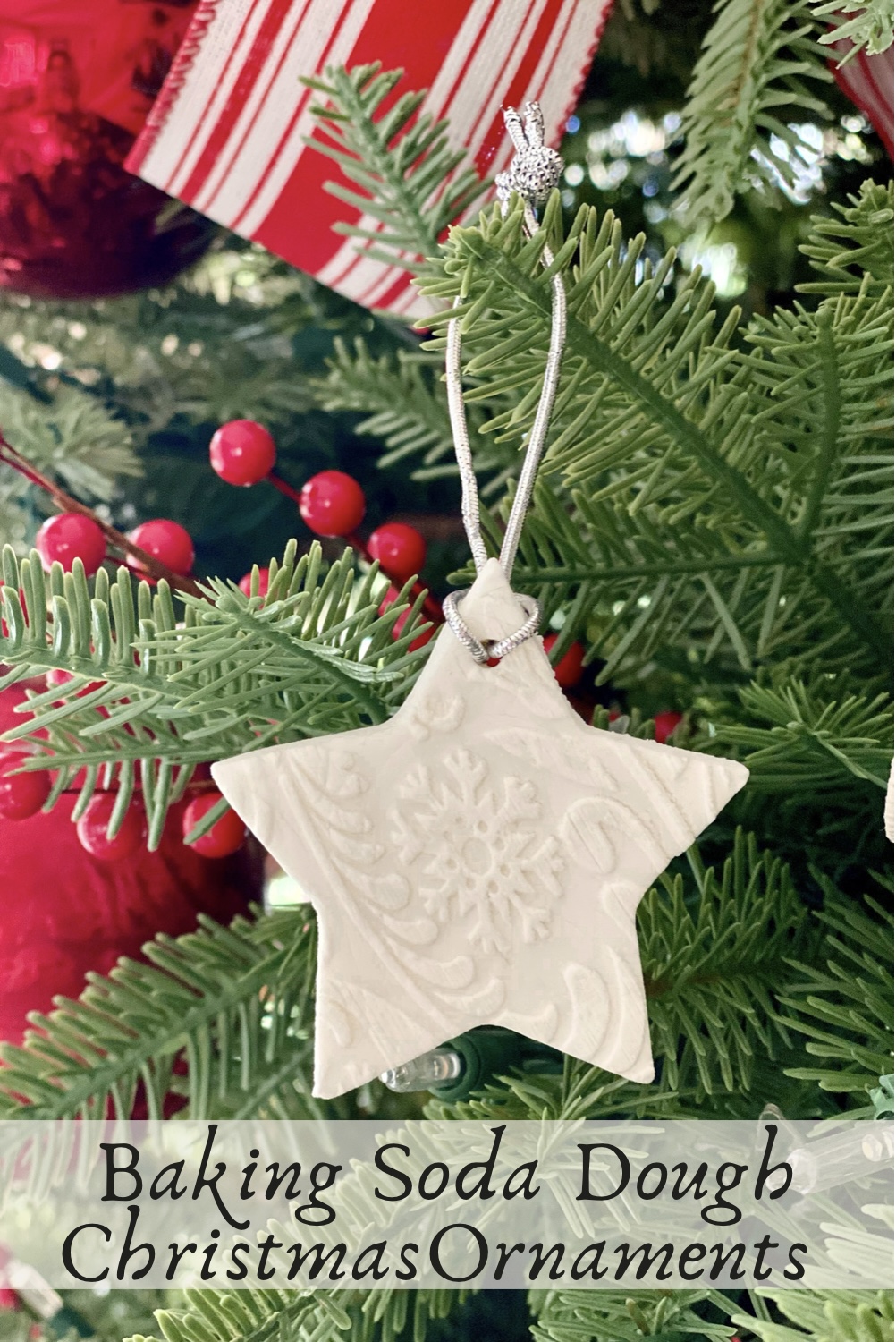 Baking soda dough ornament in the shape of a star hanging from the Christmas tree.