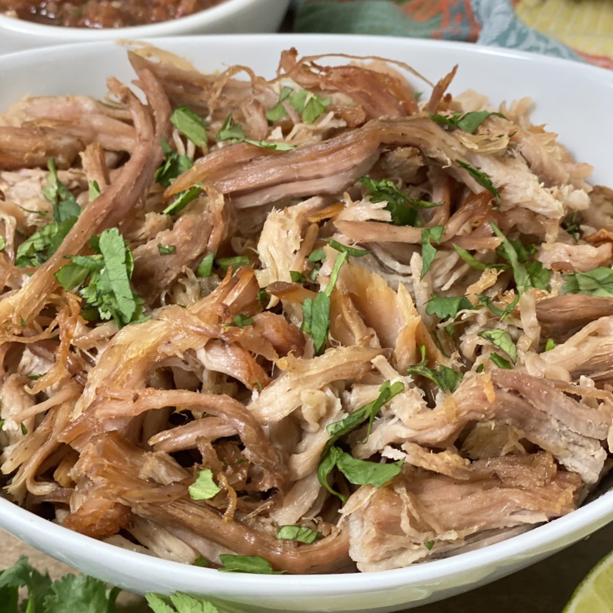 Easy Slow Cooker Carnitas in a white bowl.