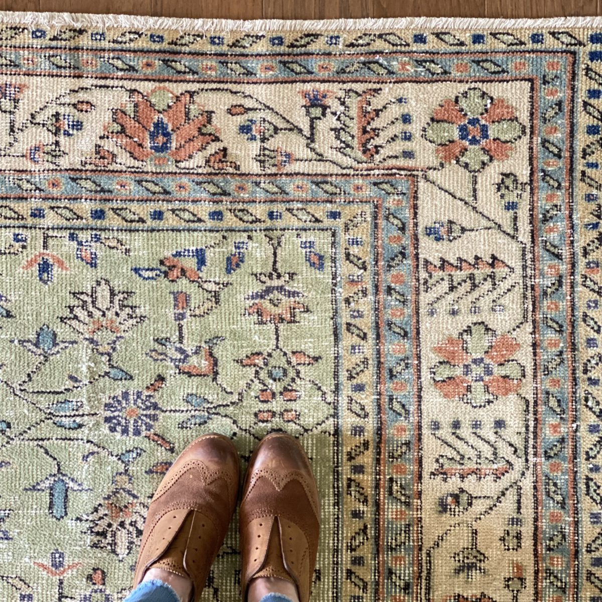 Standing on the corner of the rug, I am in Revival rug love.
