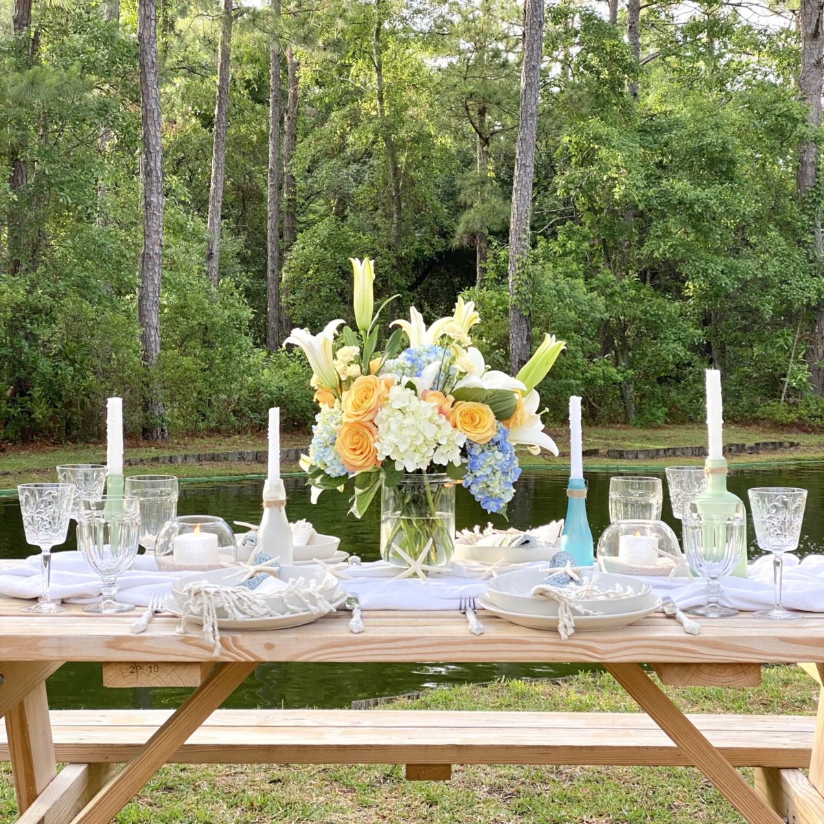 Simple summer tablescape set with a coastal theme.