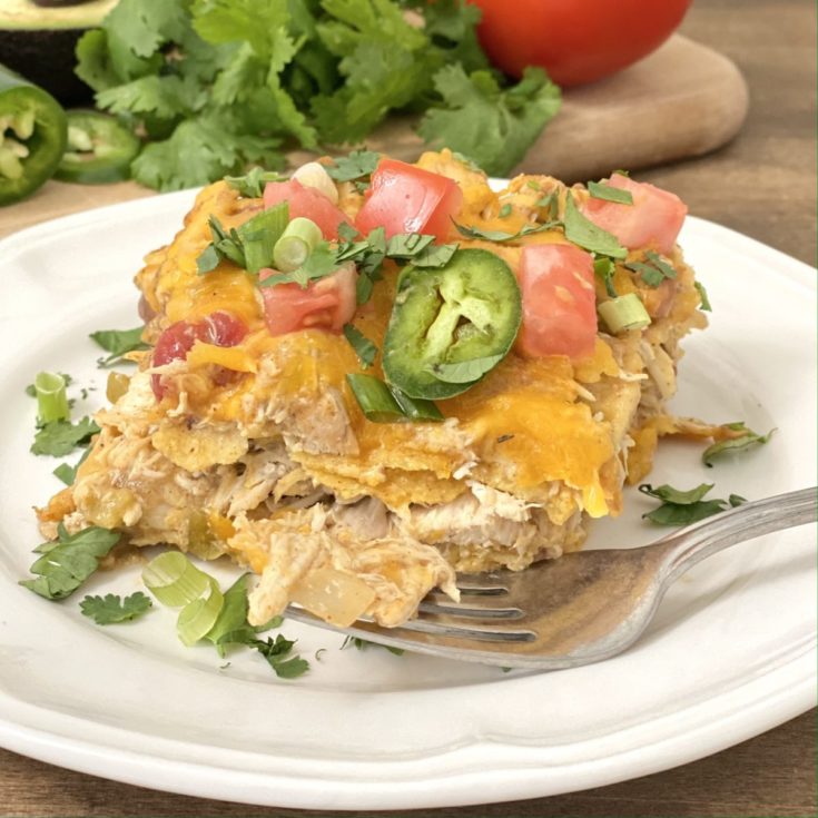 Serving of Mexican lasagna on a white plate.