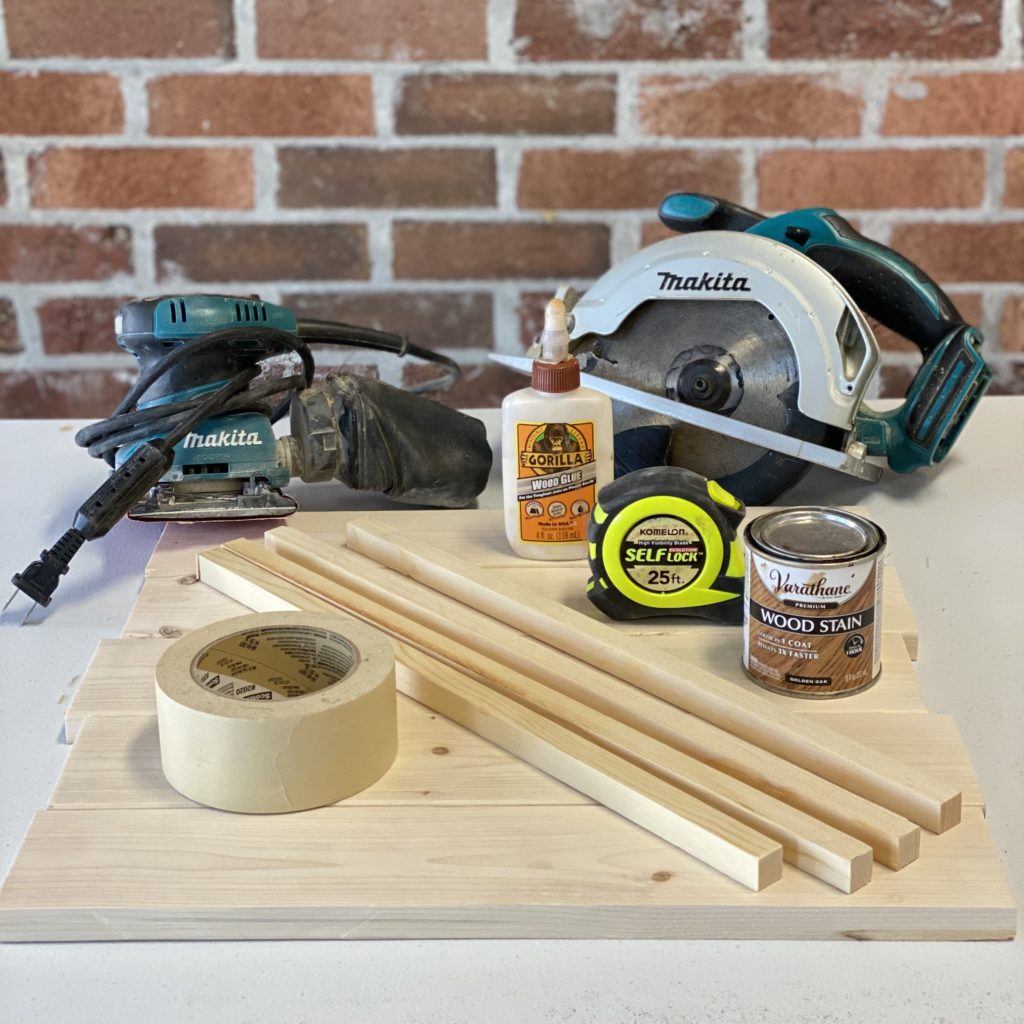 Materials needed to make a DIY checker board including wood, wood glue, tape, stain, and a saw.