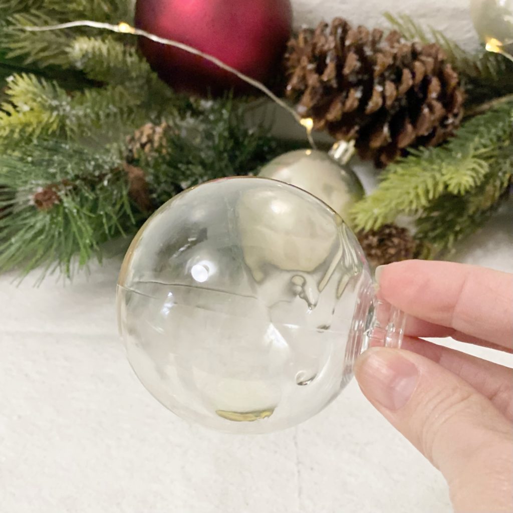 Wood oil in a clear plastic ornament.