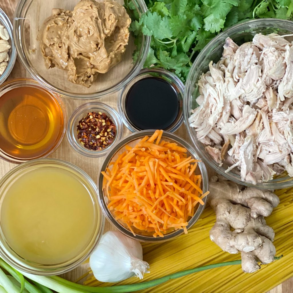 All the ingredients in this Asian Inspired Chicken and Noodles with Peanut Sauce recipe including chicken, spaghetti, carrots, peanut butter, and more.
