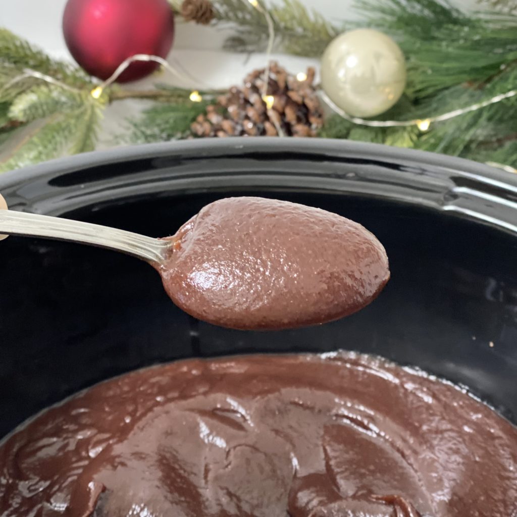 Holiday Cranberry Apple Butter on a spoon after being blended smooth.