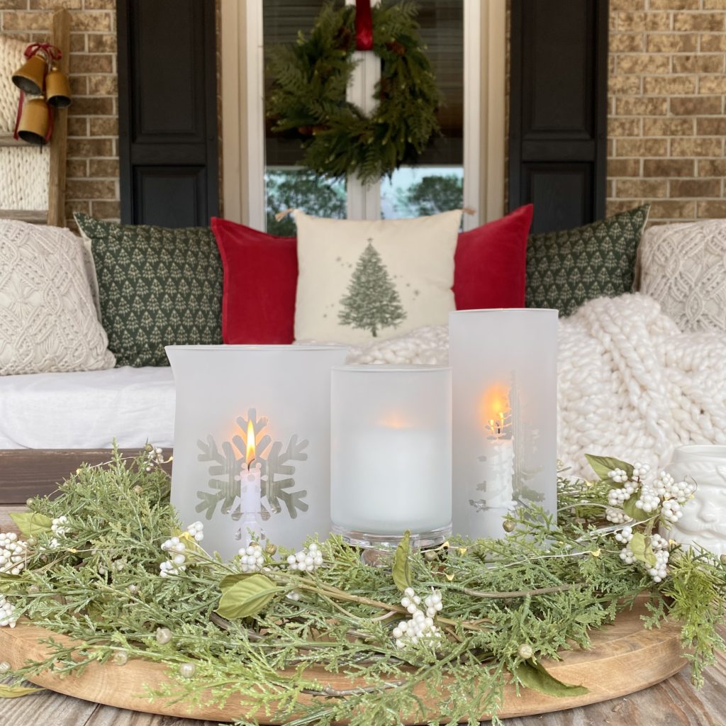 Frosted Glass Winter Candle Holders styled on a tray with evergreens on the coffee table.