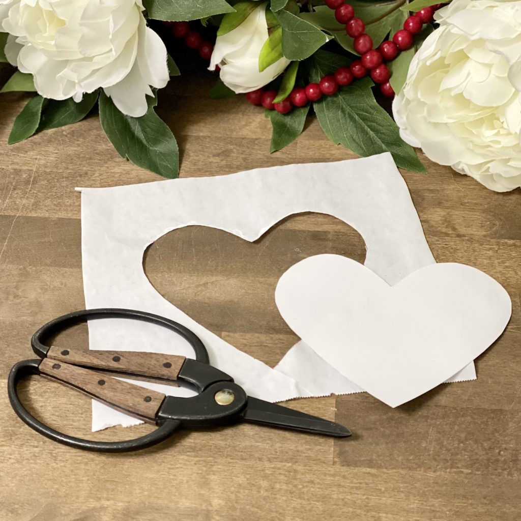 A large heart cut out of freezer paper.