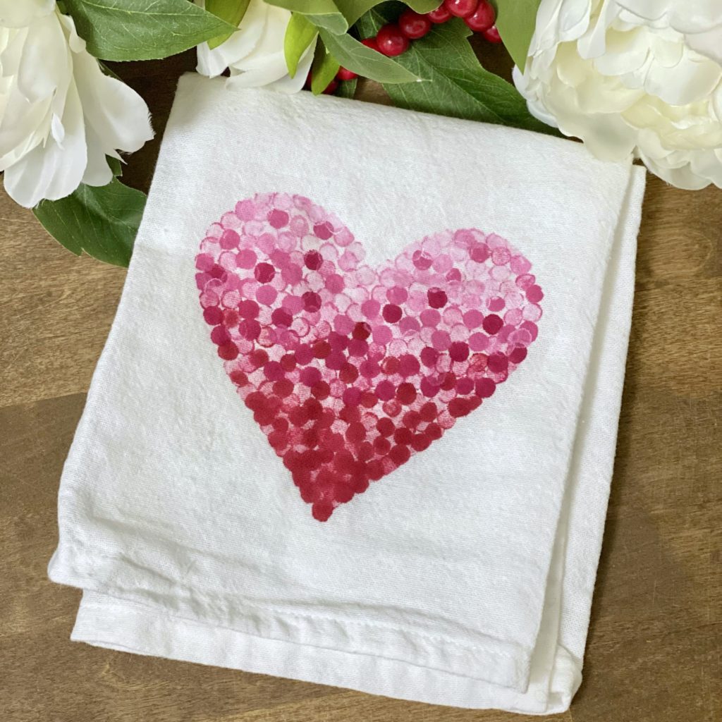 The Valentine dish towel with paint dry and set ready to be used in the kitchen.