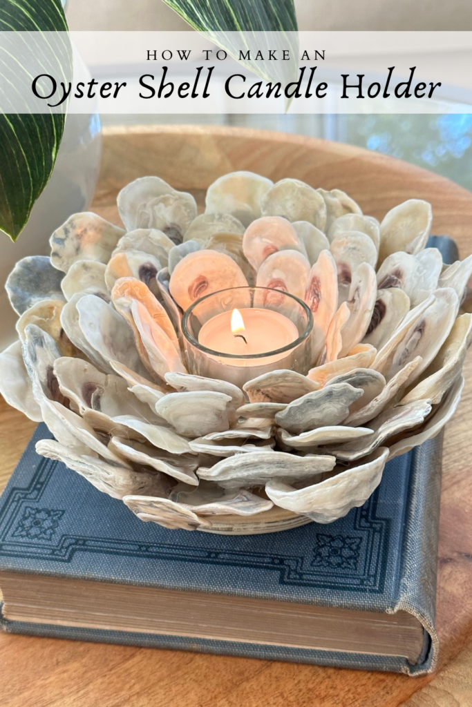 Pinterest Pin for how to make an oyster shell candle holder with a close up photo of the piece.