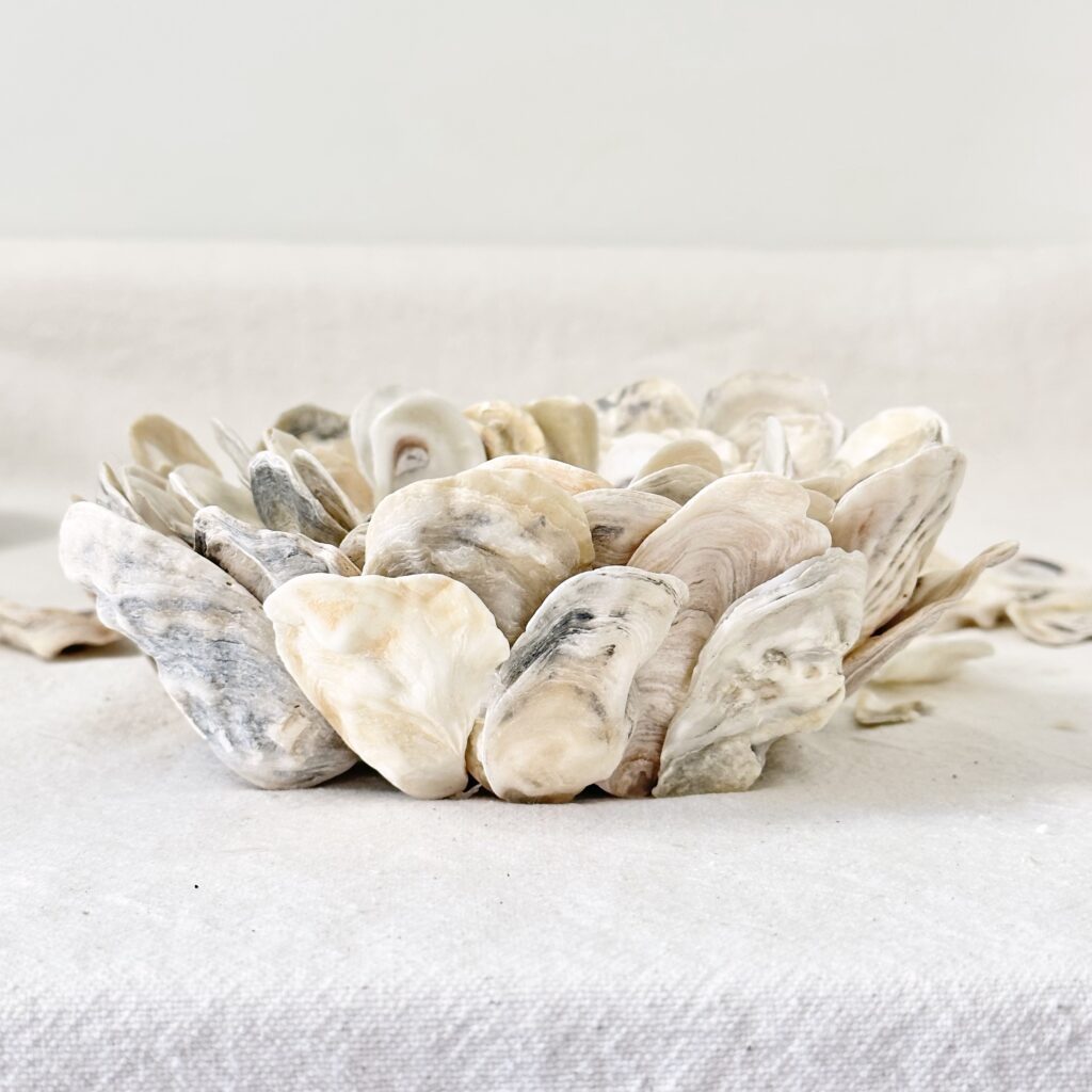A look of the oyster shell candle holder from the side to make sure all the shells on the outside meet the surface it sits on.