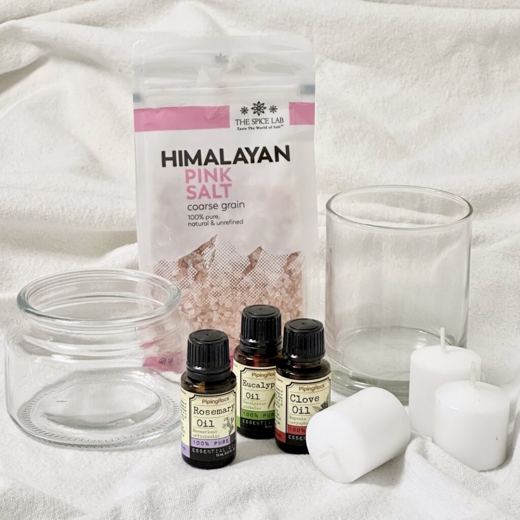 Items needed to make a DIY diffuser with Himalayan salt including small glass jar or bowl, Himalayan salt, essential oils of choice, and small votive candle. 