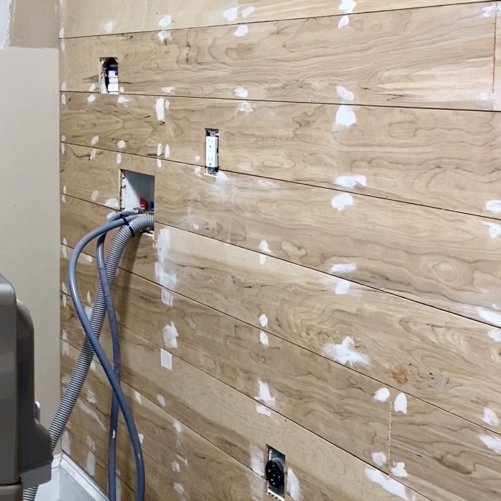 DIY plank wall with nail holes filled.