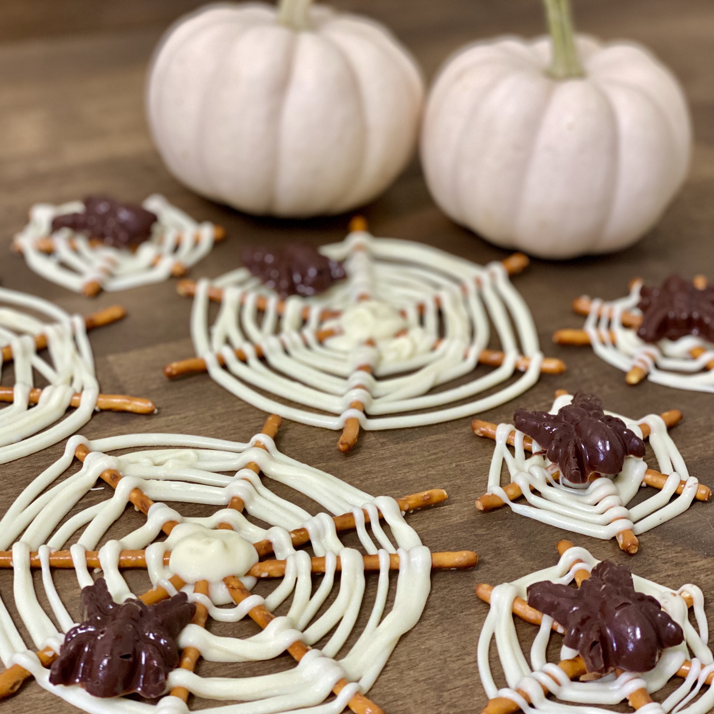 Candy spider webs made from pretzels and chocolate.