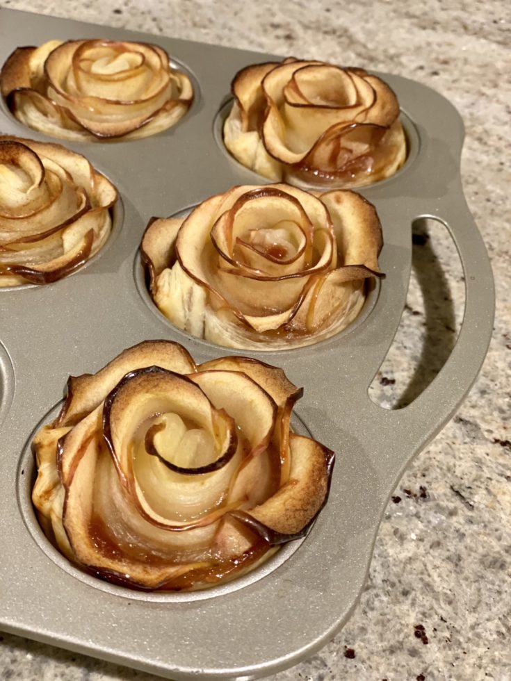 Backed Apple Roses in a muffin tin.